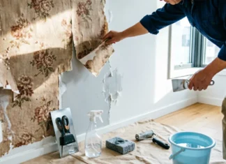 How to Remove Wallpaper: 5 Simple Methods That Actually Work How to remove wallpaper from a wall using a putty knife, spray bottle, sponge, and wallpaper removal tools