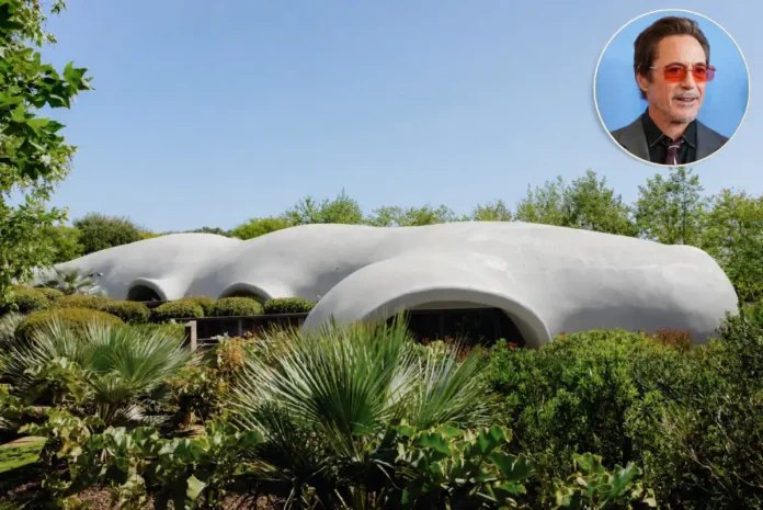 Robert Downey Jr House with a white dome-shaped exterior and lush greenery.