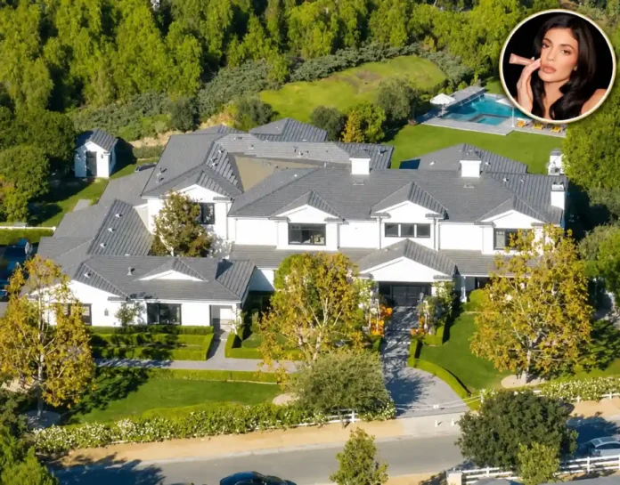 Kylie Jenner house featuring a luxurious mansion, manicured grounds, and a circular portrait of Kylie Jenner