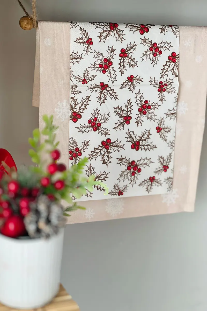 A Small Room, Dressed for December, That Still Works Every Morning 3 Holly patterned towel with red berries hanging on a wooden rod