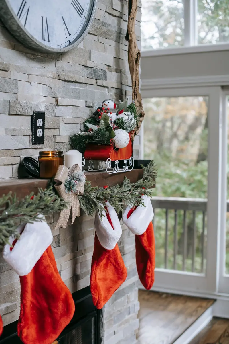 A slim wooden mantel shelf dressed with one garland line and stockings