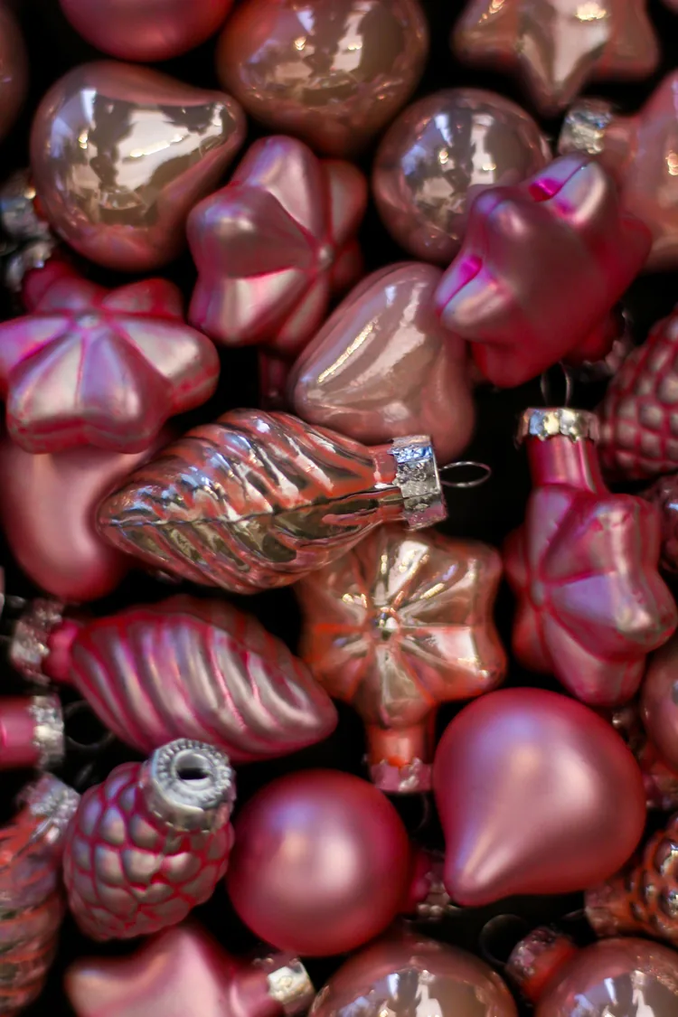7 Ways to Make Pink Feel Like Christmas, Not a Party 2 Pink Christmas ornaments in matte, glitter and mercury glass finishes.